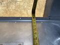 A measuring tape extended along a metal surface inside a Workhorse W62 truck with visible markings indicating length measurements