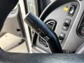 Close-up of the turn signal and windshield wiper control stalk in a 2013 Freightliner 114SD truck with labeled settings for off and various functions