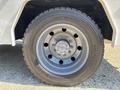 A close-up of a wheel from a 2017 Ford F-550 featuring a chrome rim and large tire with visible tread patterns and size markings