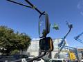 A 2011 Freightliner B2 side mirror with two reflective surfaces mounted on an extended arm