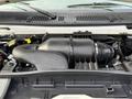 Engine compartment of a 2008 Ford Econoline showcasing the air intake system and various engine components