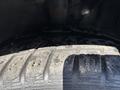 Close-up of a tire from a 2016 Ford Transit 150 showing tread patterns and wear on the rubber surface