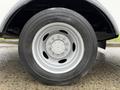 Close-up of a 2012 Ford F-450 SD tire showing the wheel rim and tread pattern with a Goodyear logo on the tire sidewall