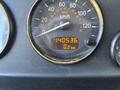 A speedometer gauge displaying a reading of 140536 kilometers with a speedometer needle pointing just above zero km/h