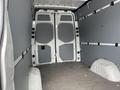 Interior of a 2025 Mercedes-Benz Sprinter van showing the cargo area with gray walls and double rear doors