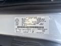 A 2019 Ford Transit 350 van with a vehicle identification label displaying specifications and manufacturing details