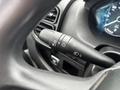 A close-up view of the steering column controls in a 2023 RAM Promaster 3500 featuring turn signal and headlight switches
