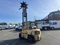 A yellow 1993 Hyster H80XL forklift with a tall mast and fork attachment in the foreground