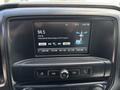 Dashboard of a 2020 Chevrolet Silverado displaying a radio screen with the station 94.5 and song information