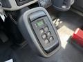 A close-up of the gear shift panel of a 2013 International 7400 featuring buttons for gear selection including park reverse neutral drive and a digital display