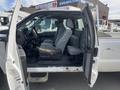 A 2014 Ford F-250 SD with an open passenger door showing gray interior seats and dashboard details