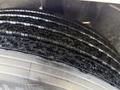 Close-up of a tire from a 2010 International 4300 showing deep tread patterns and textured surface