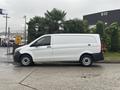 A 2021 Mercedes-Benz Metris van in white with black accents parked on a concrete surface