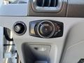 Dashboard control panel of a 2016 Ford Transit featuring knobs for lights and vehicle settings