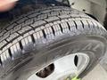 Close-up of a tire from a 2020 Chevrolet Express showing detailed tread pattern and brand logo on the sidewall