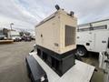 2005 Trailerman Generator Trailer with a beige exterior featuring a control panel and ventilation grid mounted on a flatbed trailer