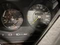 Dashboard of a 1982 Mercedes-Benz 380 showing speedometer and tachometer with gauges for temperature and fuel level