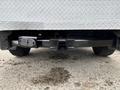 A 2013 Ford F-250 SD rear hitch with a square receiver and wiring harness attached