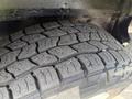 Close-up of a tread pattern on a tire from a 2008 Ford Econoline showcasing deep grooves and a rugged design for traction