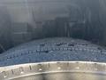 Close-up of a tire on a 2016 Isuzu NPR-HD showing tread patterns and surface texture