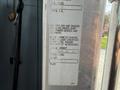 A 1996 Kenworth T800 truck's identification and weight information label displaying metrics like scale weight and total weight