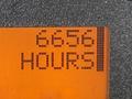 A digital display showing the number 6656 followed by the word HOURS in large pixelated text