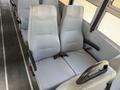 Two gray school bus seats with high backs and seat belts are positioned side by side with a clean, ribbed design