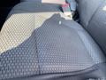 A close-up view of the front seat upholstery in a 2016 Ford F-150 with a textured fabric pattern in shades of grey