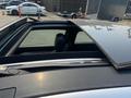 A 2013 Mercedes-Benz C-Class with a sunroof open showcasing the interior and leather seats