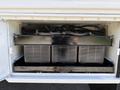 A 2009 International 3000 CE engine compartment displaying three large air filters arranged in a row with visible wiring and connectors above them