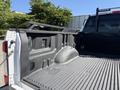A 2017 Ford F-350 SD truck bed with a spray-on liner and side rails visible
