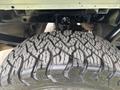 A close-up of a rugged tire with deep tread pattern mounted on a 2017 Ford F-150 showcasing its durability and off-road capability