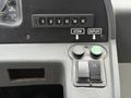 Control panel of a 2018 Grande West Vicinity featuring gear selection buttons and a stow and deploy control with green and black buttons
