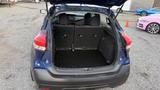 A 2019 Nissan Kicks with its trunk space open showing black interior and storage area