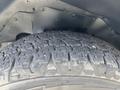 Close-up of a tire on a 2020 Chevrolet Express showcasing tread pattern and texture