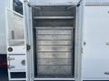 The image shows the open storage compartment of a 2006 International 4300 with multiple metal drawers stacked inside