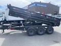 A black 2014 PJ 16 foot dump trailer with three axles is positioned at a slight angle showing its raised dumping feature