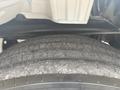 Close-up view of a tire from a 2006 Freightliner M2 106 showing tread pattern and wear on the rubber surface