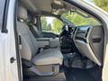 Interior view of a 2017 Ford F-550 featuring two gray upholstered front seats and a dashboard with controls and a sleek design