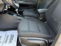 Black fabric seats of a 2018 Kia Rio5 interior with a gear shifter and console visible in the foreground