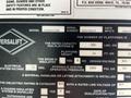 Close-up of a 2006 Ford Econoline van displaying information including model and serial numbers with various specifications listed