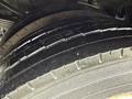 Close-up of a tread pattern on a tire from a 2012 Ford F-450 SD showing deep grooves and rubber texture
