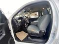 Interior view of a 2016 RAM 5500 truck featuring gray seats and a steering wheel with controls visible on the dashboard and center console