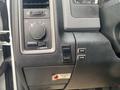 Close-up of the control panel in a 2016 RAM 5500 featuring knobs and buttons for various functions including light controls and body operations