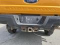 A close-up of the rear of a 2017 Ford F-250 SD showcasing the trailer hitch and bumper with the "SUPER DUTY" emblem prominently displayed