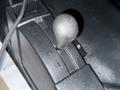 A close-up view of the gear shifter of a 2017 GMC Sierra 3500HD with marked positions for different gears