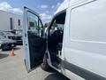 A 2024 Mercedes-Benz Sprinter van with the driver's side door open showcasing the interior and driver's seat