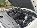 Under the hood of a 2016 GMC Sierra 1500 showcasing the engine components including the air intake system battery and various hoses and wires