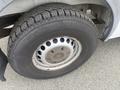 The image shows the wheel of a 2009 Dodge Sprinter Van featuring a tire with a textured tread pattern and a silver wheel rim with ventilation holes