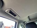 A close-up of the overhead console in a 2018 Toyota Highlander featuring air vents and a light fixture